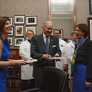 Annie Thibault from the Colorectal Cancer Prevention Network at USC present Governor Henry McMaster and Lt. Governor Pamela Evette with colorectal cancer awareness scarf and tie.